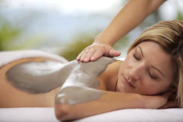 Image of a lady having a mud treatment at one of New Zealand's many luxury spas