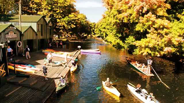 Image of the Antigua Boat sheds in Christchurch where you can go punting on the River Avon