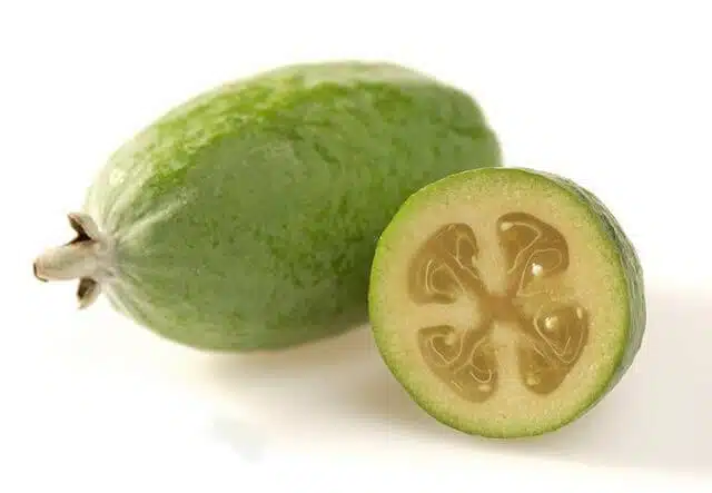 A whole feijoa and a half feijoa