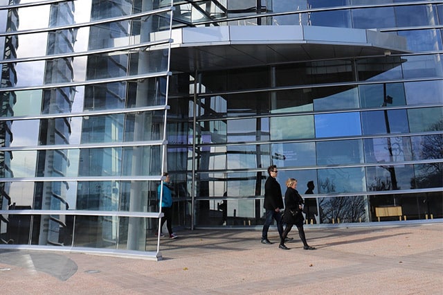 2 people walking outside the christchurch art gallery